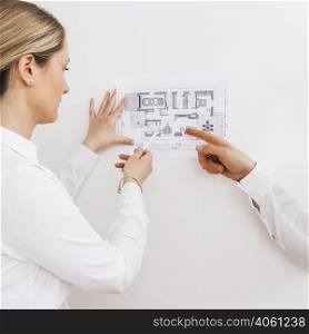 young female architect designer working blueprint project new apartments