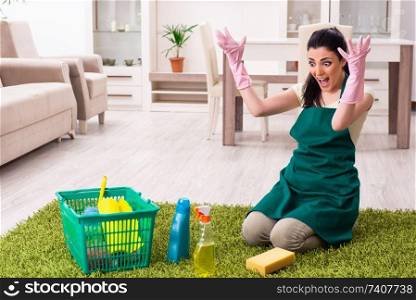 Young female contractor doing housework
