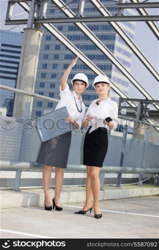 young female contractors in a front of building site