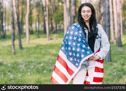 young female covered with flag usa