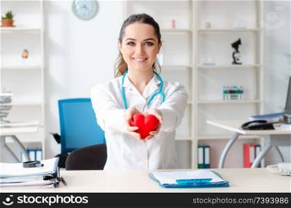 Young female doctor cardiologist working in the clinic 