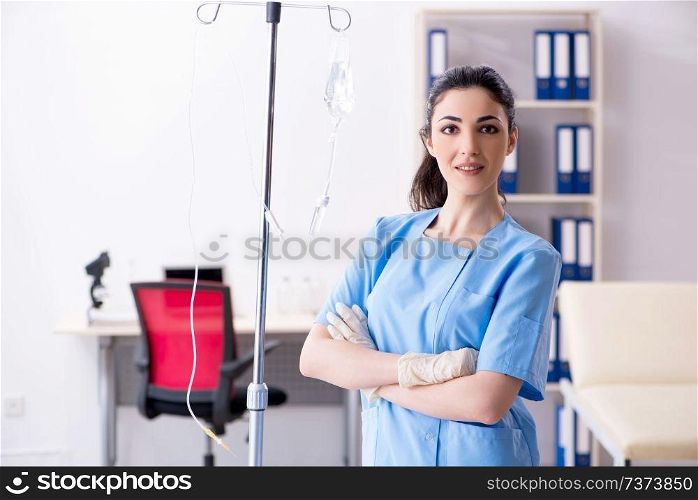 Young female doctor in infusion concept 