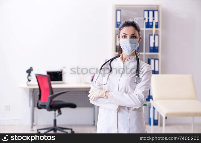 Young female doctor in infusion concept 