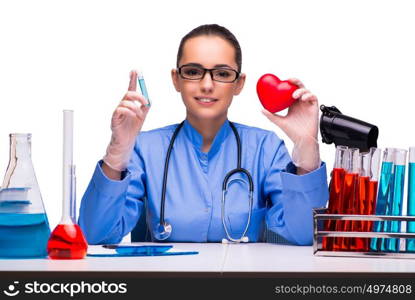 Young female doctor in lab isolated on white