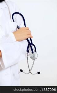 young female doctor portrait. Portrait of happy successful young female doctor holding a stethoscope