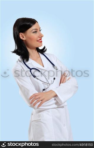 young female doctor portrait. Portrait of happy successful young female doctor holding a stethoscope
