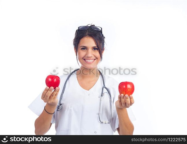 young female doctor showing two beautiful red apples
