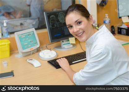 young female doctor studying mri results