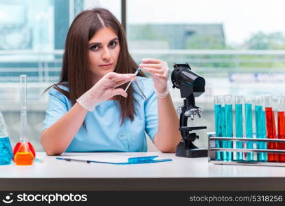 Young female doctor working in the lab