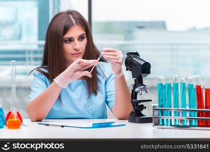 Young female doctor working in the lab