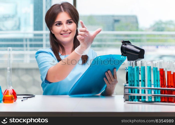 Young female doctor working in the lab