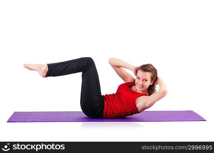 Young female doing exercises on white