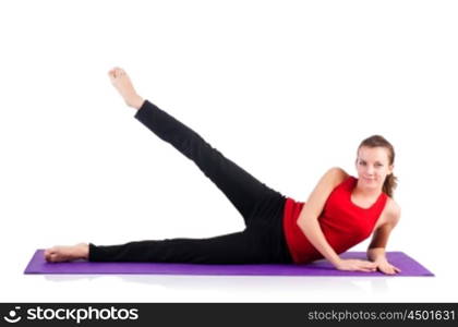 Young female doing exercises on white