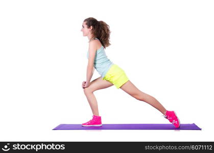 Young female doing exercises on white