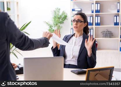 Young female employee being fired from her work . Young female employee being fired from her work