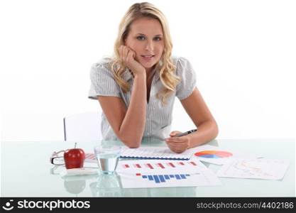 young female employee drawing charts