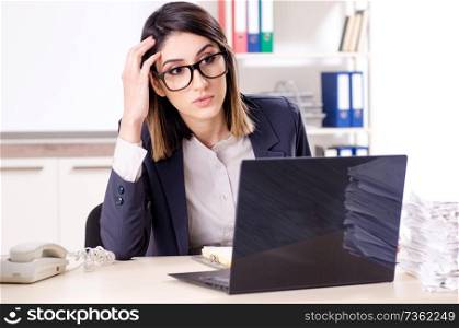 Young female employee working in the office