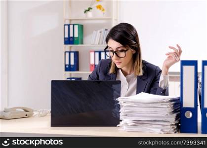 Young female employee working in the office 