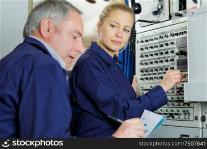 young female engineer looking contemptuously at elder