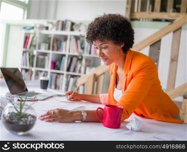 Young female engineer working in office. Getting your house plan ready