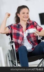 young female enjoying video games at home