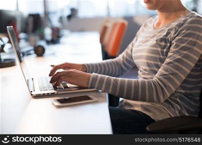 Young female Entrepreneur Freelancer Working Using A Laptop In Coworking space