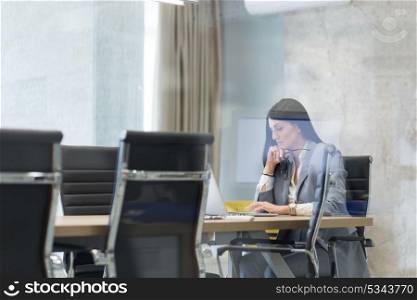 Young female Entrepreneur Freelancer Working Using A Laptop In Coworking space