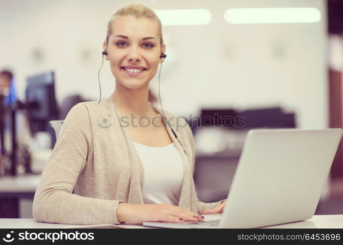 Young female Entrepreneur Freelancer Working Using A Laptop In Coworking space