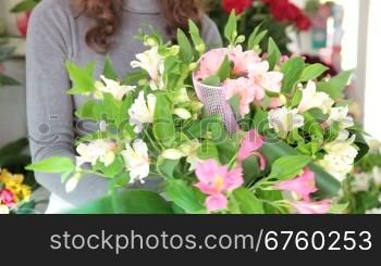 Young Female Florist Creating Flower Arrangement Of Alstroemeria In Her Store. Focus On The Bouquet