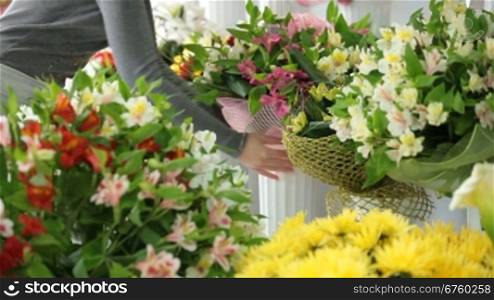 Young Female Florist Working In Flower Shop