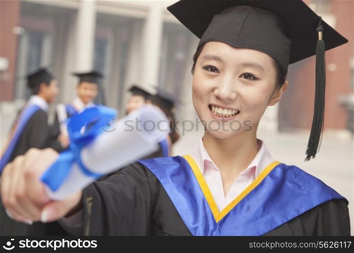 Young Female Graduate Holding Diploma