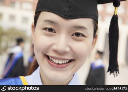 Young Female Graduate Smiling, Close Up
