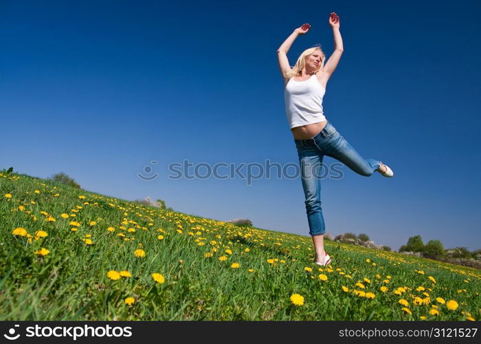 young female having fun on flowery meadow