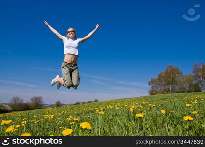 young female having fun on flowery meadow