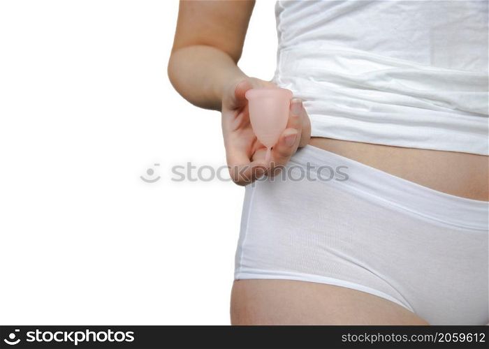 Young female holding menstrual isolated on white background, device into vagina with menstruation, Environmental,woman concept copy space. Young female holding menstrual isolated on white background, device into vagina with menstruation, Environmental,woman concept