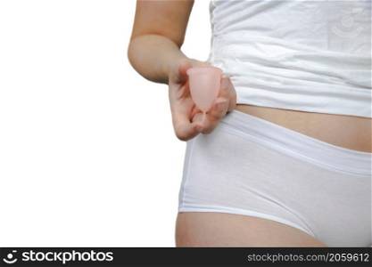 Young female holding menstrual isolated on white background, device into vagina with menstruation, Environmental,woman concept copy space. Young female holding menstrual isolated on white background, device into vagina with menstruation, Environmental,woman concept
