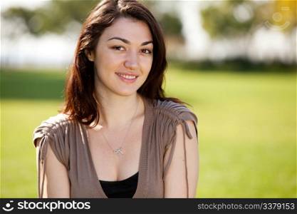 Young female model in outdoor setting. Horizontally framed shot.