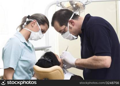Young female patient takes a dental attendance in the dentist&acute;s office.