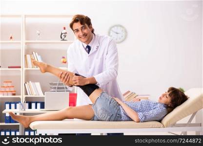 Young female patient visiting male doctor traumatologist . The young female patient visiting male doctor traumatologist 