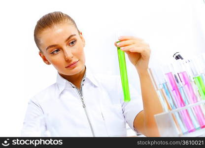 Young female scientist working with liquids in laboratory