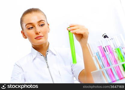 Young female scientist working with liquids in laboratory