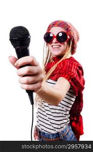 Young female singer with mic on white