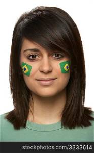Young Female Sports Fan With Brazilian Flag Painted On Face
