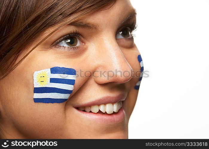 Young Female Sports Fan With Uruguayan Flag Painted On Face