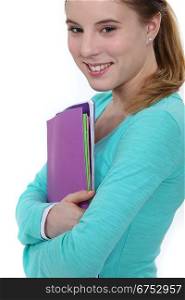 Young female student carrying folders