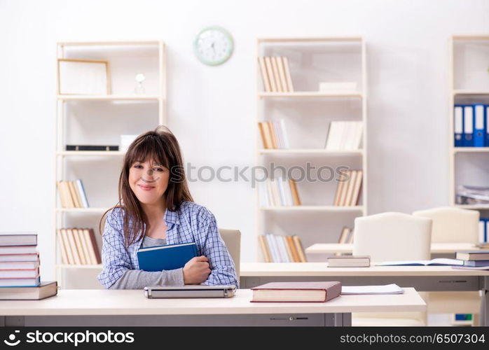 Young female student in educational concept