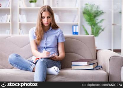 Young female student preparing for college exams
