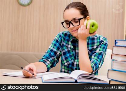 Young female student preparing for exams