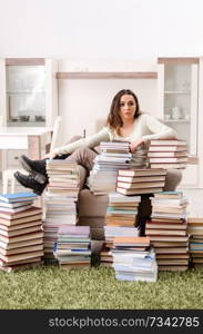 Young female student preparing for exams at home 