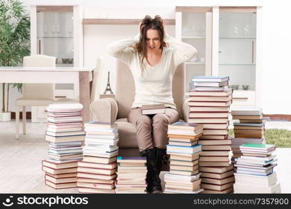 Young female student preparing for exams at home 